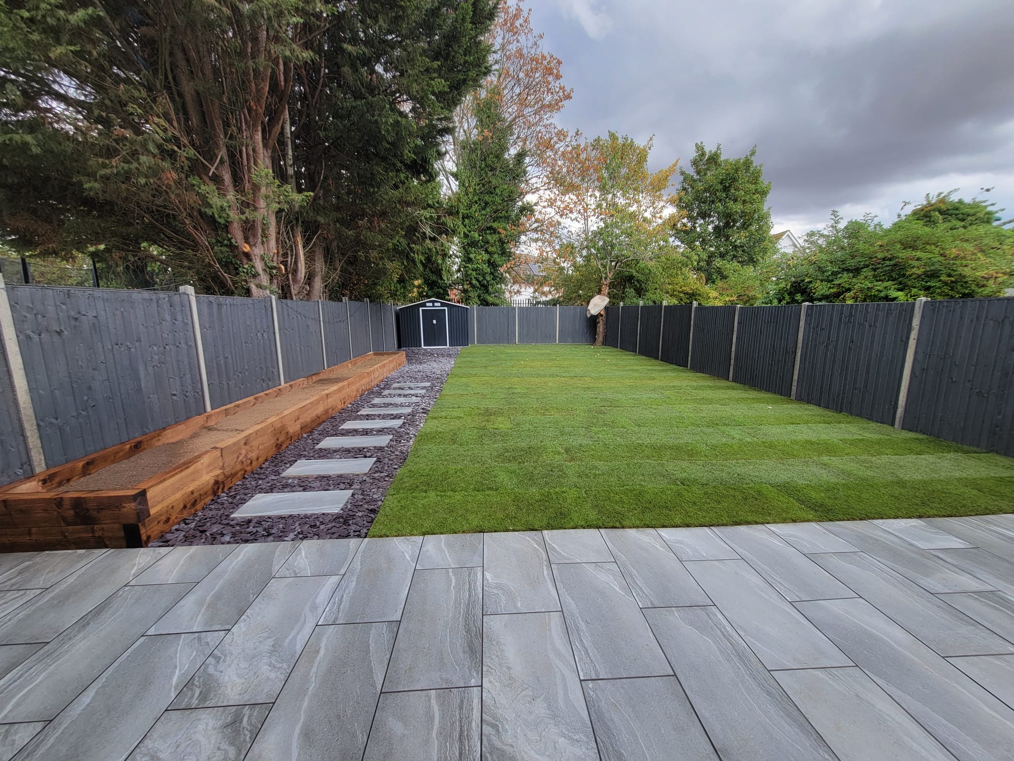 Finished landscaped garden with lawn and paving